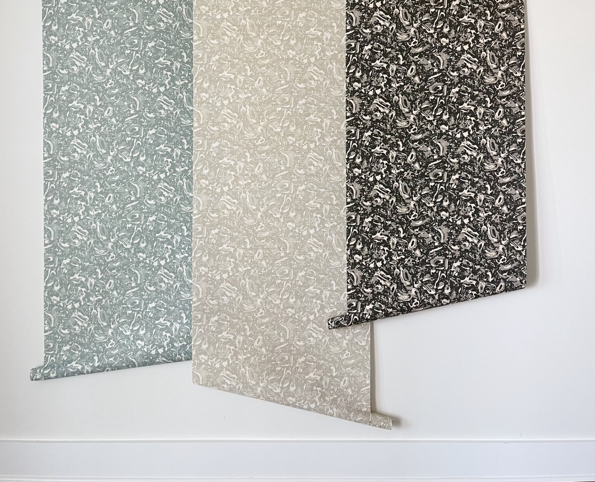 Emily Daws River Reef Grasscloth shown in three colorways: Ocean, Natural and Coal.